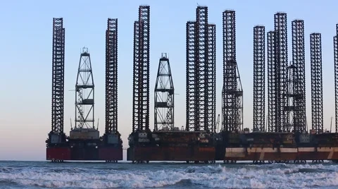 Beach waves with oil platform in ocean. Caspian sea offshore oil rig drilling pl Stock Footage 62019887