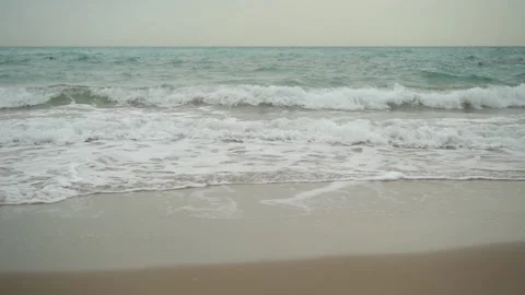 Beach with waves of the sea and the shore of sand. Brown, blue and gray color Stock Footage 137387053