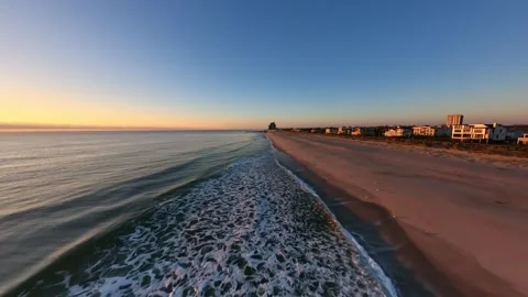 Beach Waves in Slow Motion during Sunrise in 4K Stock Footage 253580914