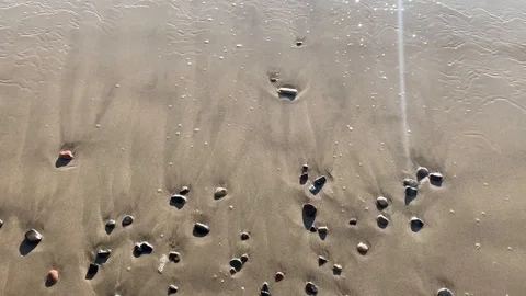 Beach Waves Spell out L-I-V-E in rocks  스톡 동영상 121232695