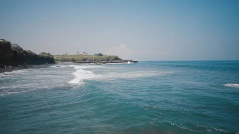 Beach Waves on a Sunny Day, escape to azure waves, picturesque coastline, serene Stock Footage 276642811