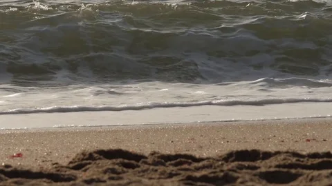 Beach waves in a sunny day Stock Footage 77765774
