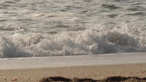 Beach waves in a sunny day slow motion Stock Footage