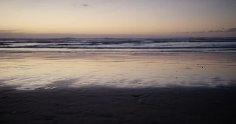 Beach waves at sunset Stock Footage 125410805