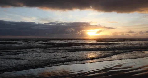 Beach waves at sunset Stock Footage 165264735