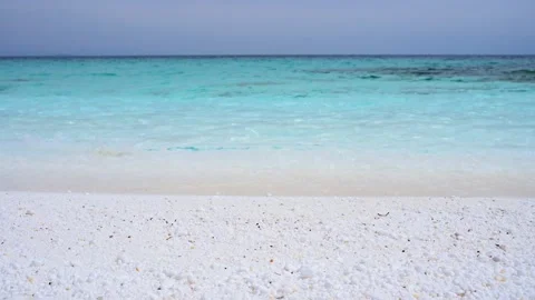 The beach with white marble pebbles and turquoise sea on the Greek island of Stock Footage 239193869