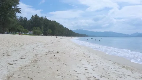 Beach with white sand and wave from sea in sunshine daytime Stock Footage 153321582