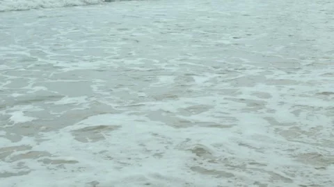 The beach with white sand and wave from peaceful sea in sunshine daytime Stock Footage 246467563