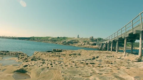 The beach with woden bridge Stock Footage 128755354