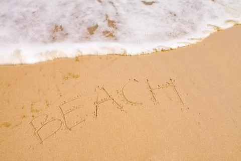 The beach word on sand Stock Photos