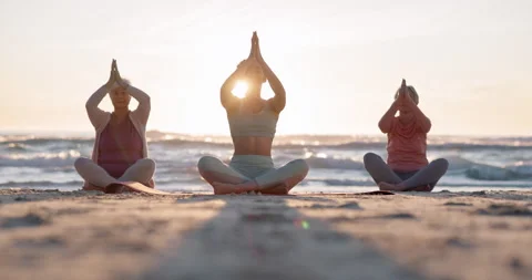 Beach yoga class, sunset and meditation instructor coaching zen mindset Stock-Footage 248693360
