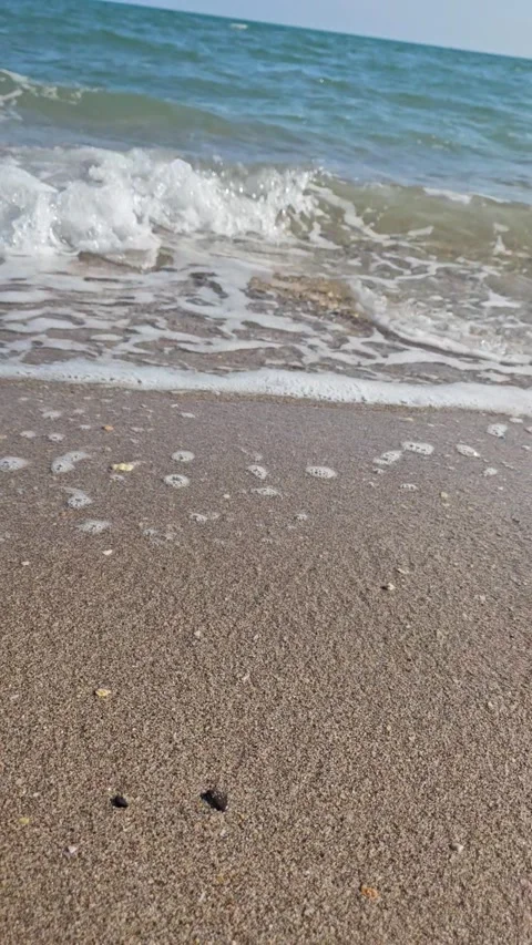 Beache close up with little waves Stockbeeldmateriaal 319348406