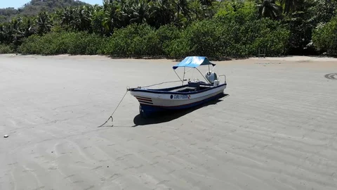 Beached boat orbit Stock Footage 127121686
