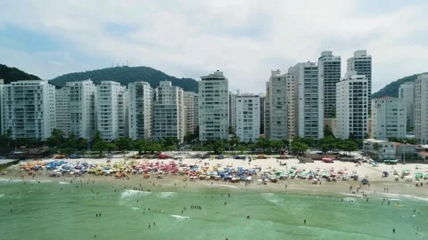 Beachfront cityscape view, tropical beach paradise, urban beach scene Stock Footage 309274859