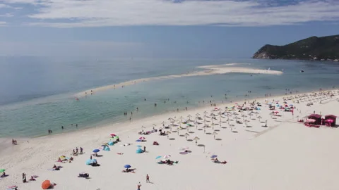 Beachfront complex on the ocean. Peninsula and sandy coast in Portugal, Europe. Stock Footage 166114568