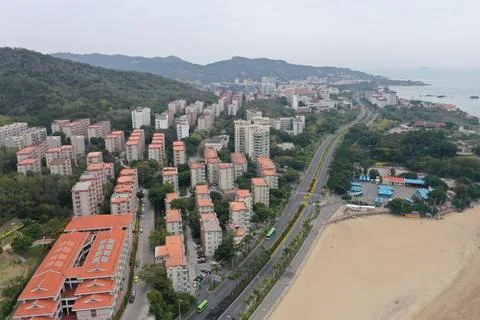 Beachfront Residential District with Elevated Highway and Sandy Shore Stock Photos