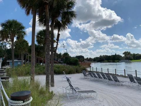 Beachfront resort with palm trees Stock Photos