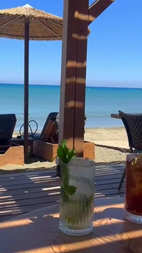 Beachfront Restaurant Dining Area with Drinks - Vertical 4K 스톡 동영상 336340167