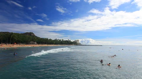 Beachgoers Diving into the Sea at Kuhio Beach Stock Footage 330217668