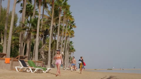 Beachgoers at Playa Sotavento Lagoon Stock Footage 268921707