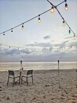 A beachside dining setup at Negril Beach, Jamaica, offering a perfect tropi.. Fotos de archivo