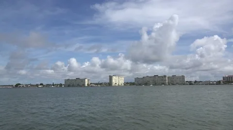 Beachside High Rise Waterfront Condos With Fluffy Clouds Stock Footage 56715686