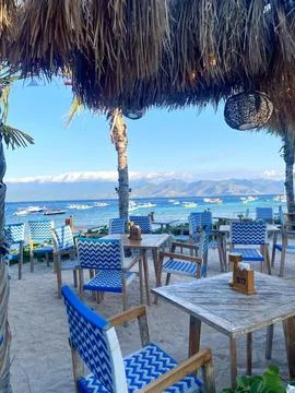 Beachside Restaurant Seating With Ocean View and Tropical Atmosphere Stock Photos