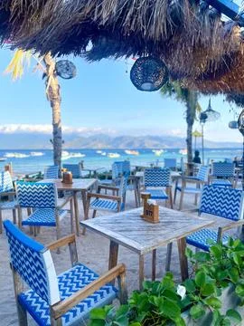 Beachside Restaurant Seating With Ocean View and Tropical Atmosphere Stock Photos