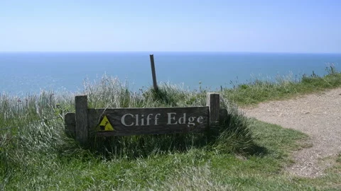 Beachy head cliffs warning sign and sea view 3840 x 2160 @ 29.97fps Stock Footage 242041904