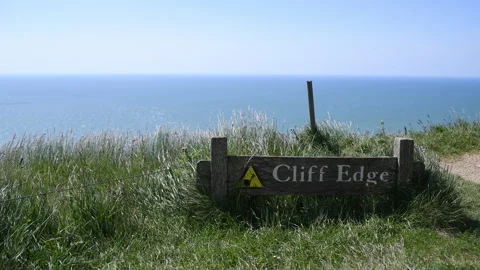 Beachy head cliffs warning sign and sea view 3840 x 2160 @ 29.97fps Stock Footage 242042577