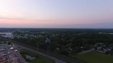 Beacon atop microwave tower at dawn as camera moves downward Stock Footage 53032633