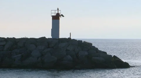 Beacon on break wall at sunrise Stock Footage 68442343