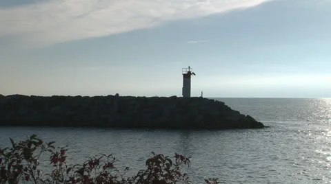 Beacon on break wall at sunrise Stock Footage 68442356
