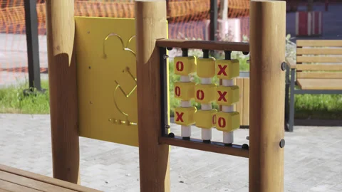 Bead maze and tic tac toe on children playground in park Видео 330285370