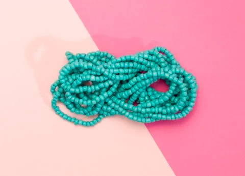 Bead Neckless on a Duel Colored Background Stock Photos