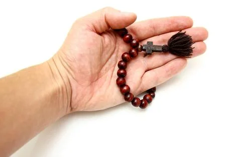 Bead-roll In a hand bead-roll with wooden elements isolated on white backg... Stock Photos