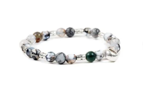Beaded bracelet on the white surface Stock Photos