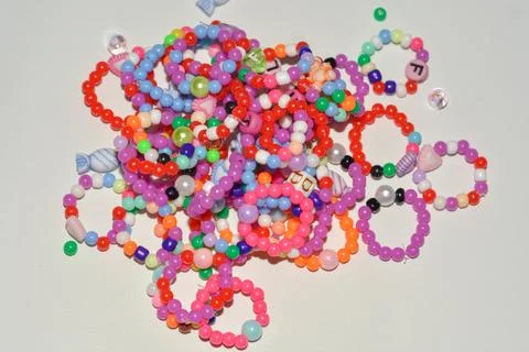 Beading workplace with hands in the process of handicraft. Beautiful diy je.. Stock Photos