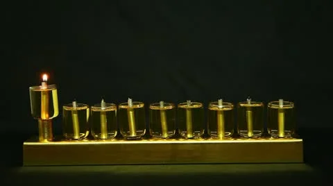 Beadle flame in Hanukia made of olive oil lanterns Stock Footage