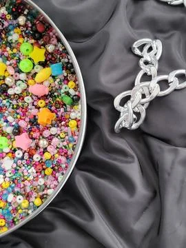 Beads and chain creative combo on black Stock Photos
