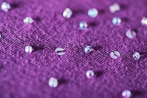 Beads and sequins Macro background of textile with beads and sequins. Shal... 스톡 사진