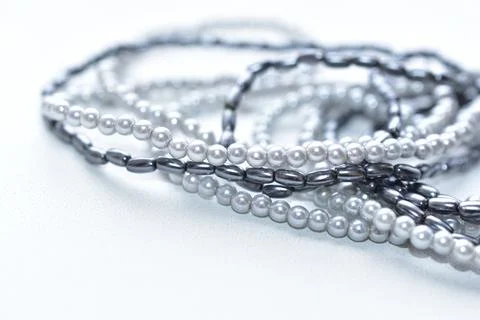 Beads of blue beads on a white background costume jewelry Stock Photos