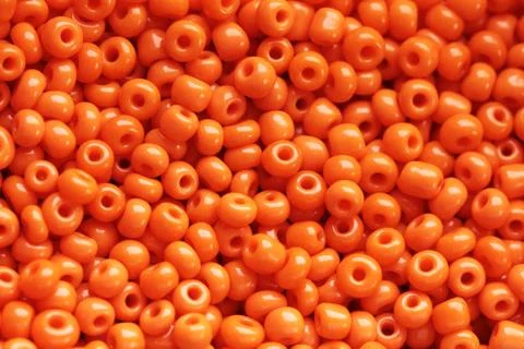 Beads of orange colour Stock Photos