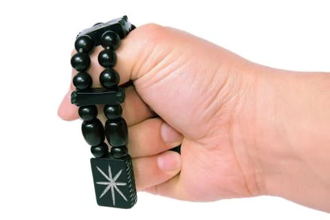 Beads with patterns in a fist on a white background 写真素材