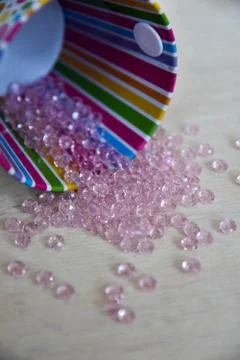 Beads in a small bucket Stock Photos