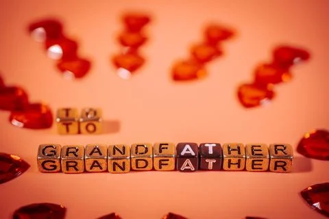 Beads on a warm background form the words &amp;quot;To Grandpa&amp;quot;. Stock Photos