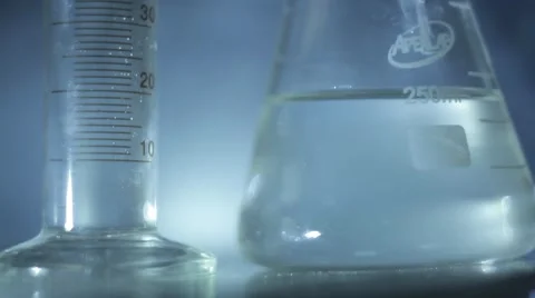 Beaker and Flask on a Glass Table Stock-Footage 54615084