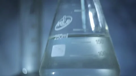 Beaker and Flask on a Glass Table. Panorama Stock-Footage 54615172