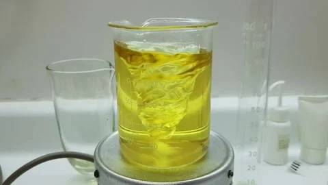 Beaker on a magnetic stirrer Stock Footage 138886549