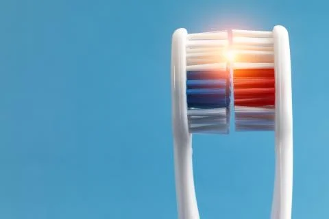 Beam of light between two toothbrushes Foto stock